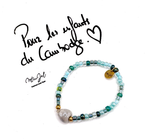 Capsule humanitaire pour les enfants du Cambodge.

Bracelet élastique pour les grandes et les petites - Perle cœur en céramique gris - Perles de rocaille.